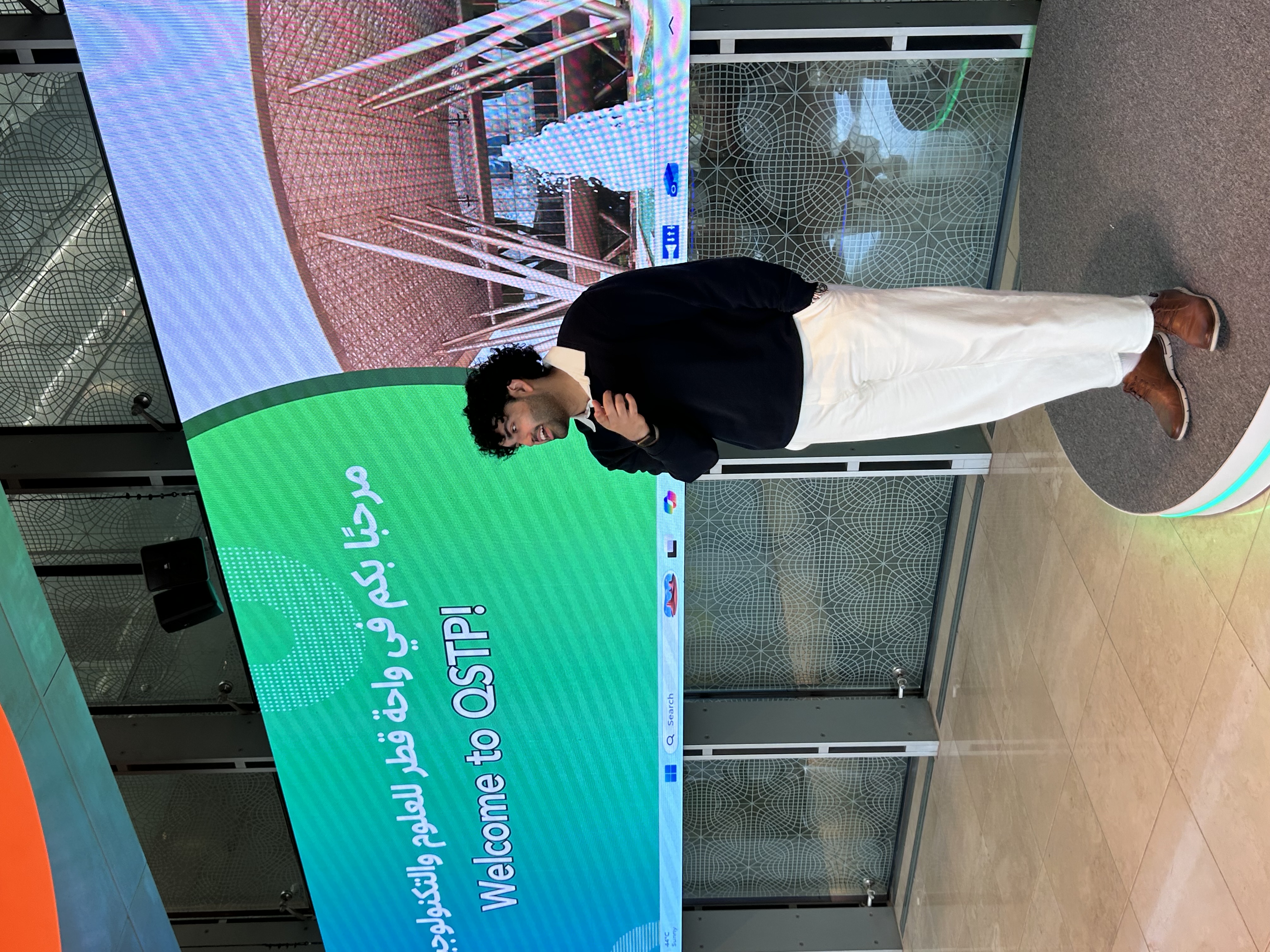 Sports Vector presenter speaking during the Claude AI workshop at QSTP